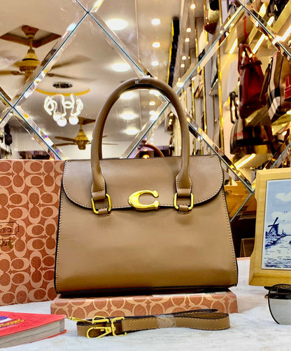 Coach Handbag – Elegant & Versatile with Long Belt